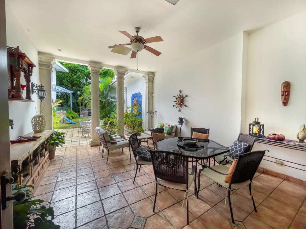 Elegant dining area bright with chandelier large windows marble floors in luxury house Panama City