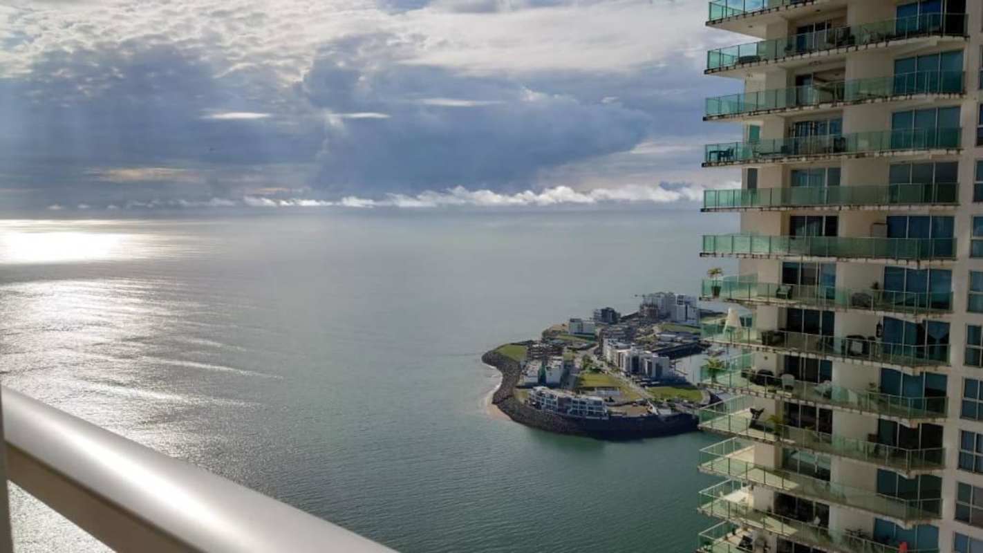 Modern waterfront building with glass balconies at PH Aquamarina Punta Pacifica