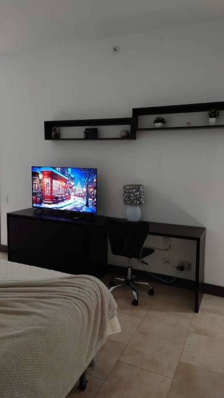 Modern bathroom with marble counters, double sinks, glass shower at PH Aquamarina Punta Pacifica