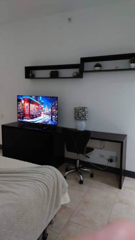 Elegantly furnished bedroom with ocean view window in PH Aquamarina Punta Pacifica