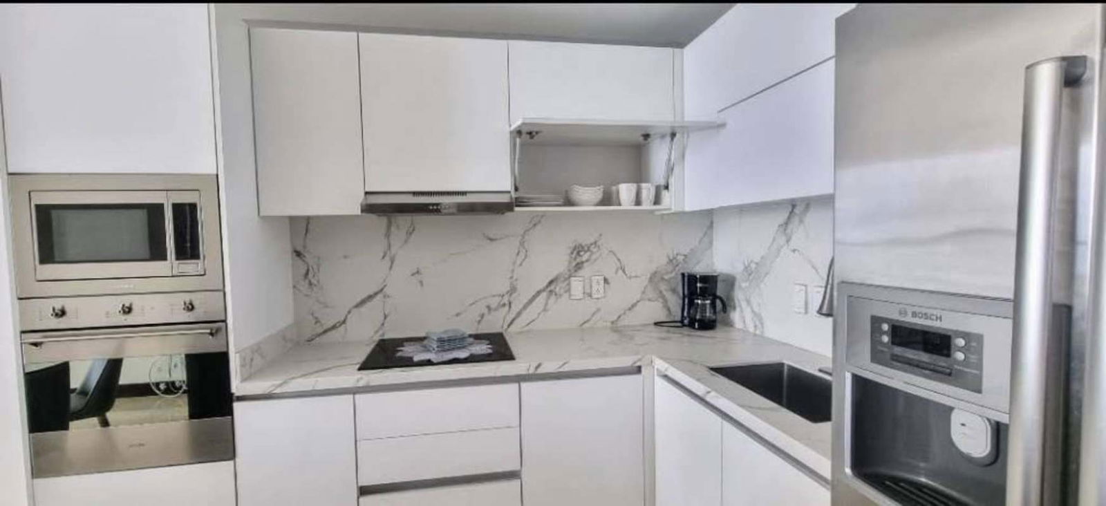 Marble kitchen countertops with open living dining design PH Pacific Point Panama