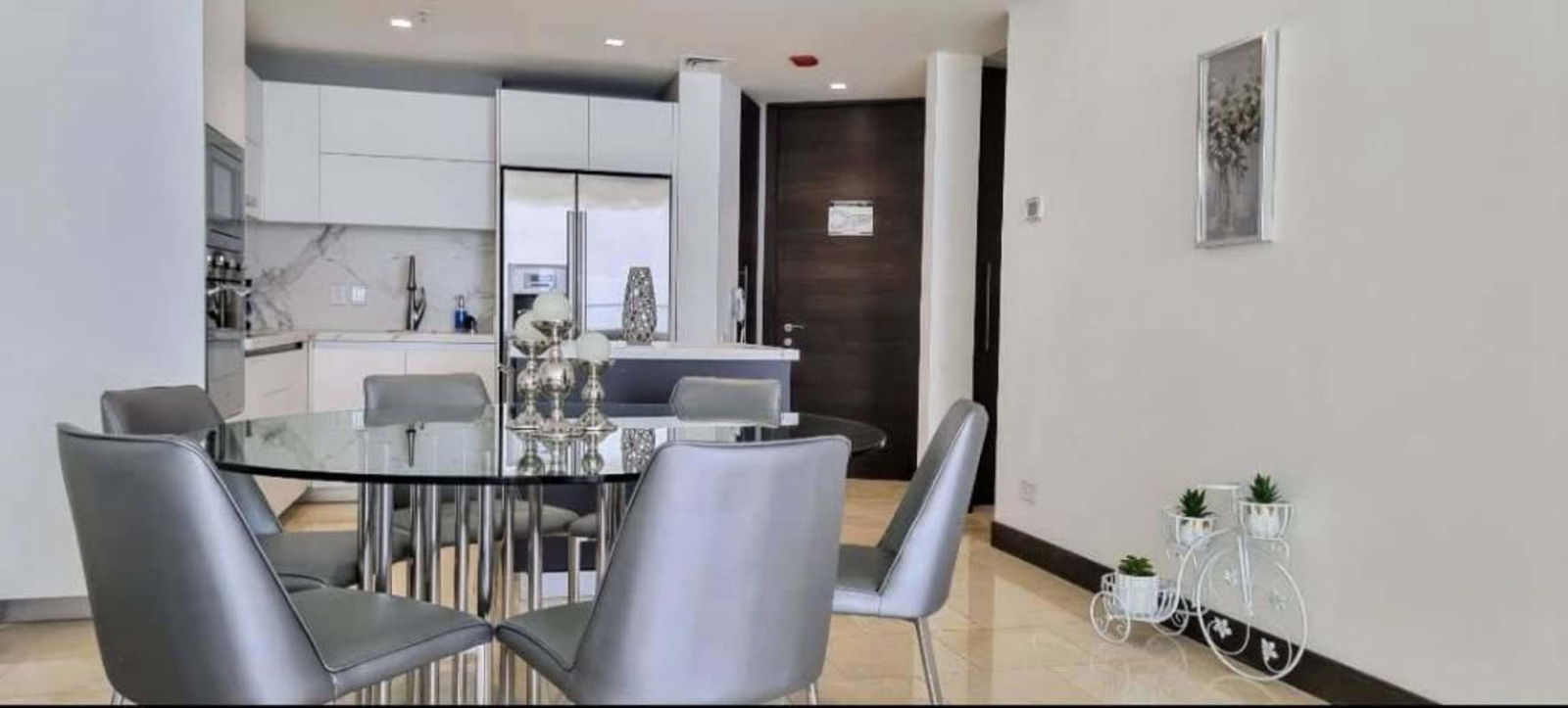 Furnished bedroom with Pacific Ocean view floor-to-ceiling windows at PH Pacific Point Punta Pacifica