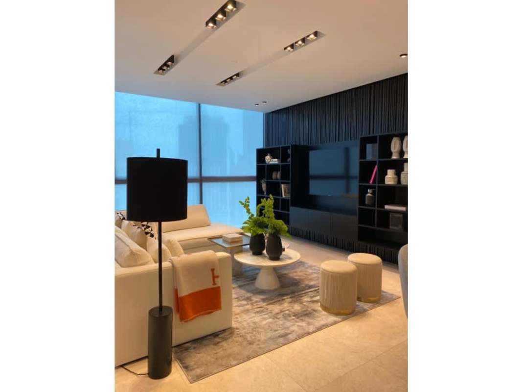 Modern dining room and living space with city views in PH Deluxe Residences Punta Paitilla Panama City