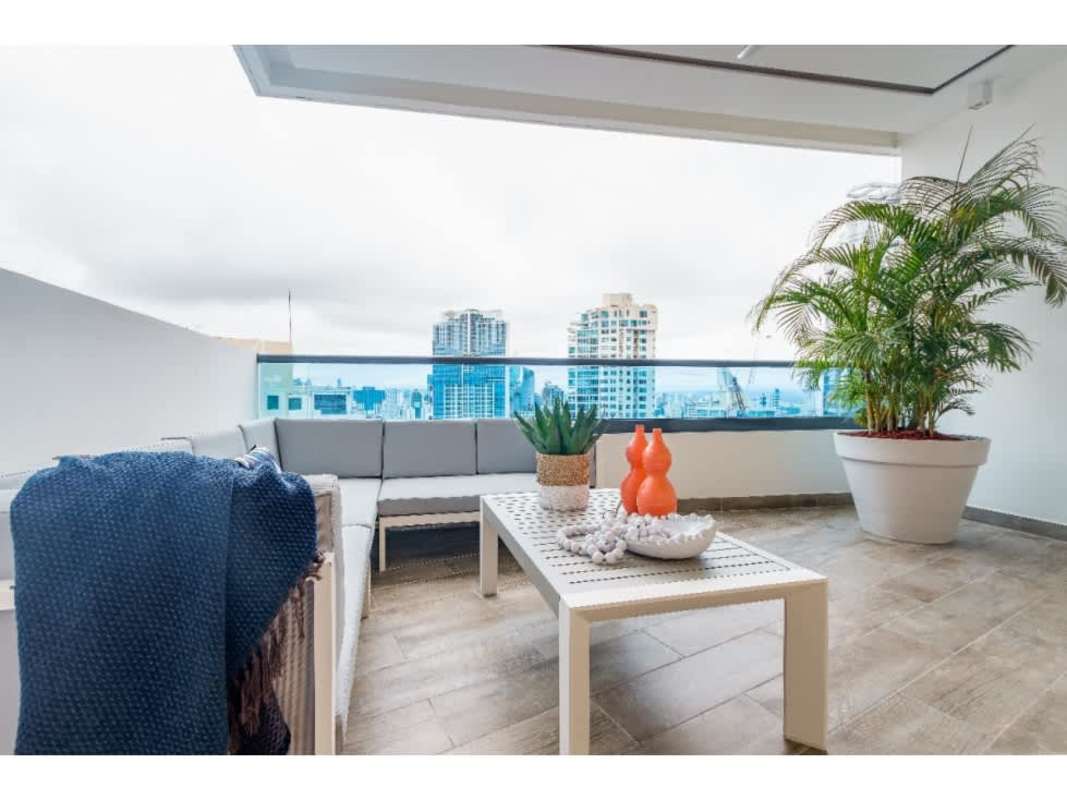 Expansive balcony with modern furniture and panoramic city views in PH Deluxe Residences Punta Paitilla Panama