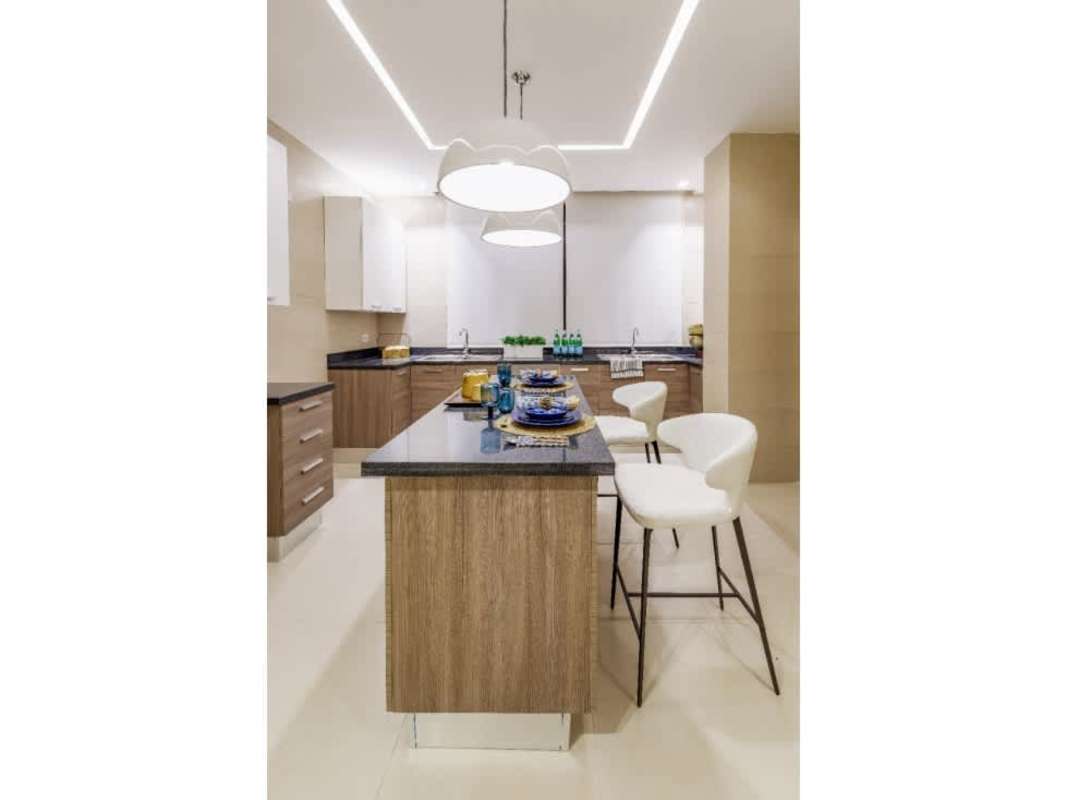 Contemporary kitchen with island, sleek cabinetry, granite counters in PH Deluxe Residences Punta Paitilla Panama