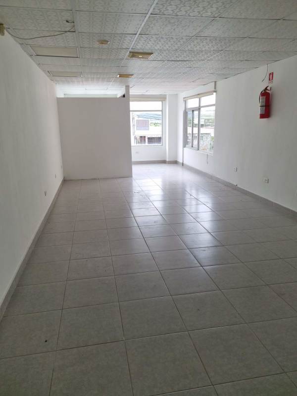 Bright empty commercial office space with tiled floors and windows at PH Madison Tower