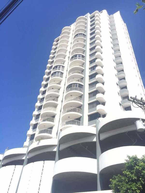 Modern bathroom with glass-enclosed shower, granite vanity and tile at PH Lexus Tower Panama