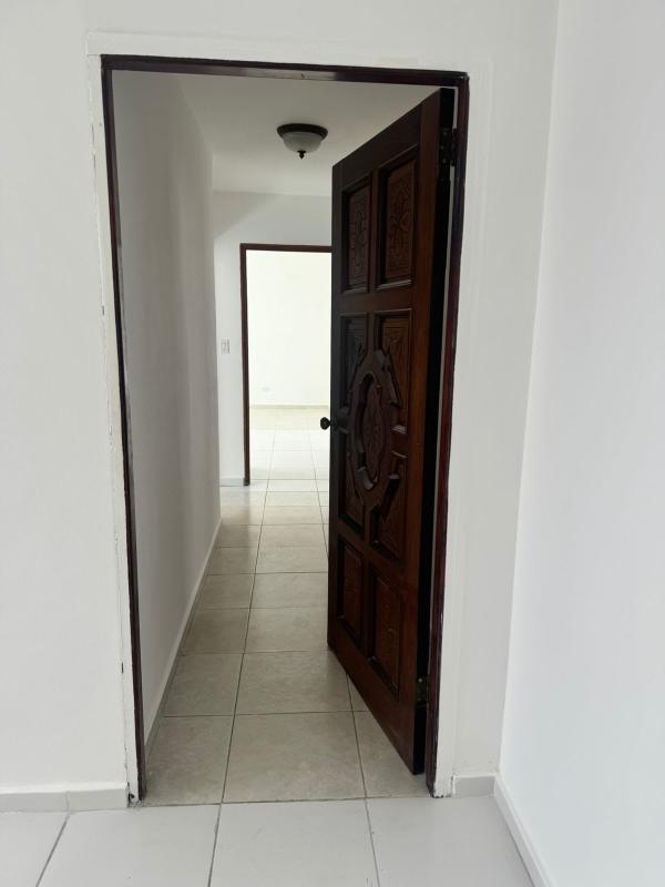 Entry hallway with decorative doors, tile floors, modern design in PH Lexus Tower Panama