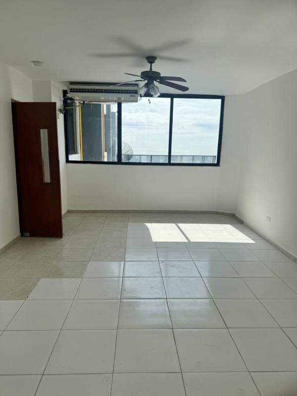 Empty second bedroom with city view window, tile floor and closet at PH Lexus Tower Panama