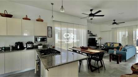 Spacious integrated living and dining room with tile floors and ceiling fans PH Las Islas Punta Barco