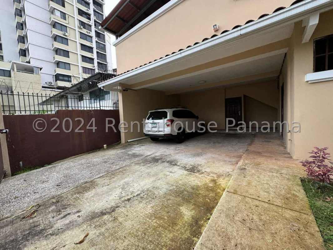 Seven-car covered garage driveway with security gate in El Carmen Panama house