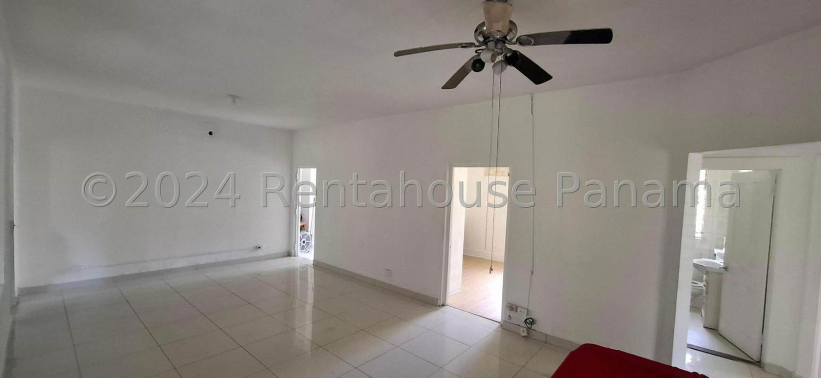 Bedroom with large windows, natural light, wooden flooring and neutral walls Clayton Panama