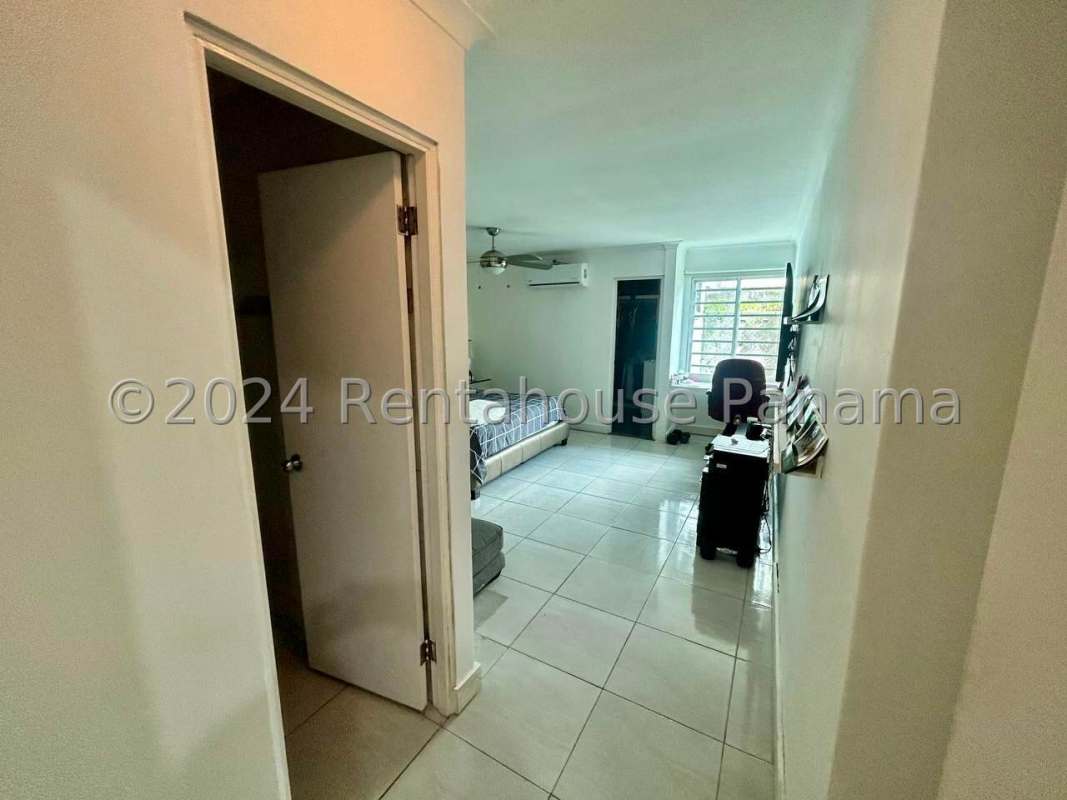 Modern kitchen with window stainless appliances tile backsplash in Panama City house