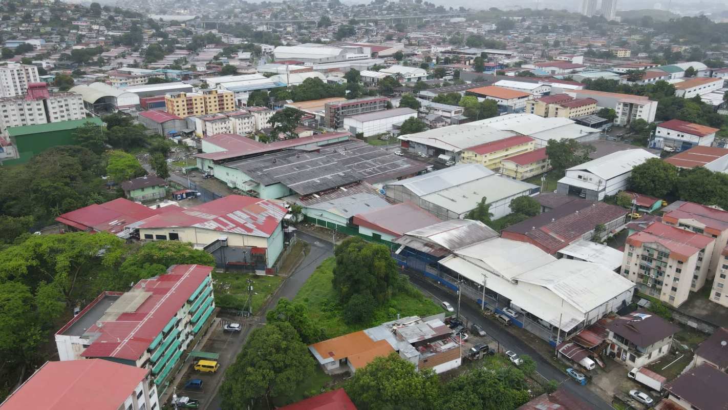 Aerial with 1200m2 outlined lot in urban mixed-use Panama City development area