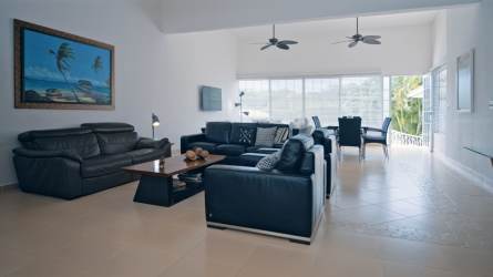 Large living and dining area with natural light in Playa Coronado Panama beach home