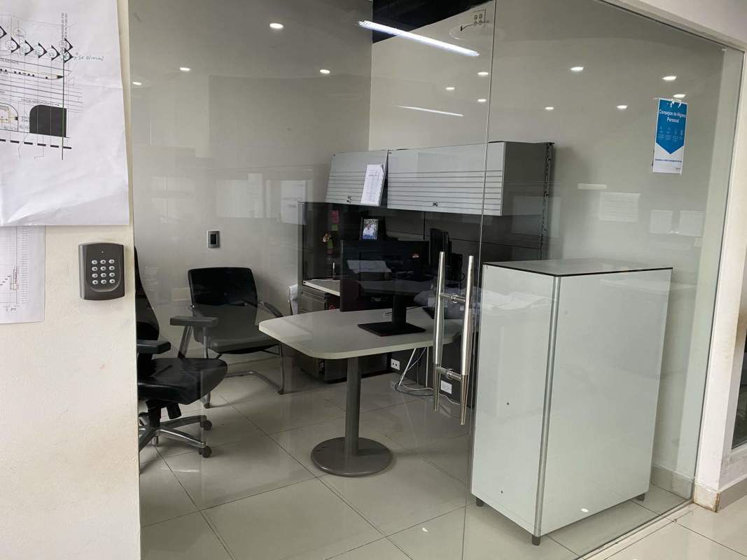 Marble conference table with floor-to-ceiling windows city view in PH Ocean Club