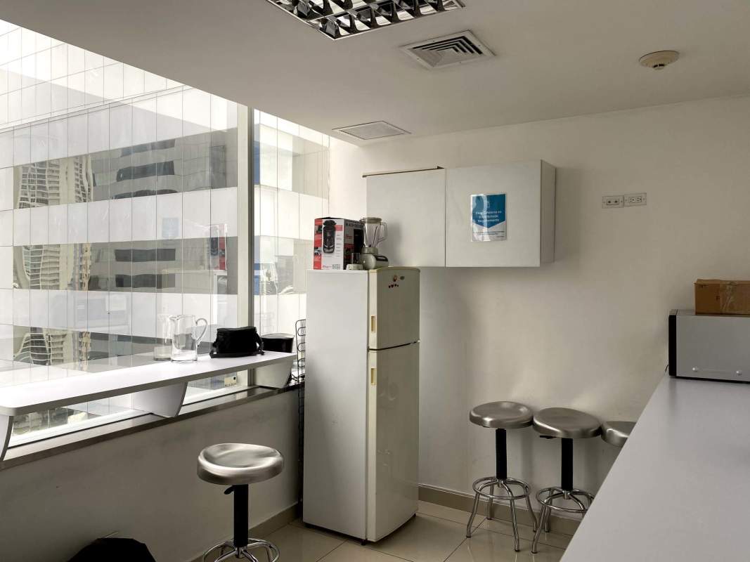 Panoramic kitchenette area with large window view in PH Ocean Club corporate space Panama City