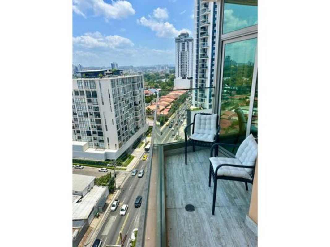 Bedroom with large window offering city skyline view, built-in closet in Coco del Mar