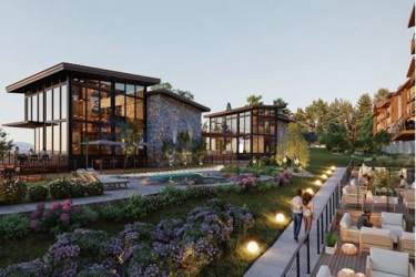 Glass residential building complex with pool and landscaped gardens at sunset Boquete Mountain Estate