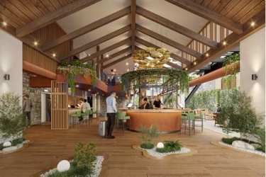Spacious rustic lobby with vaulted beams greenery and central circular bar Boquete Mountain Estate Panama