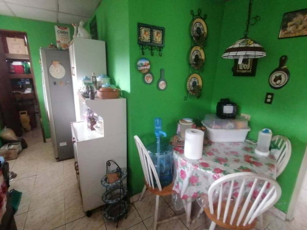 Bedroom featuring tiled floor, two windows with blinds and bright lighting in Pradera del Rocio Panama