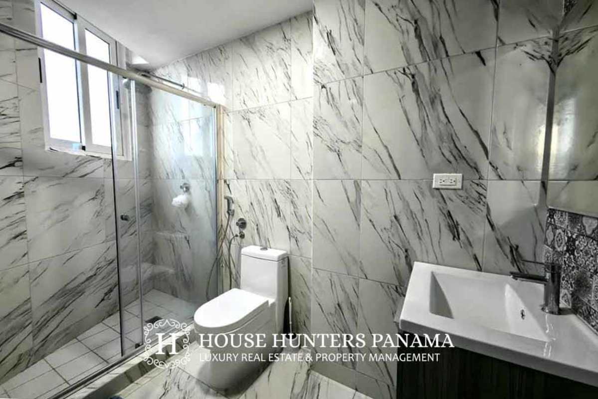 Contemporary kitchen with granite countertop, stainless appliances in The Sands