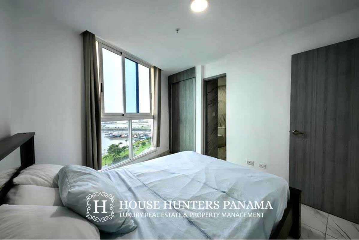 Bedroom with large window, marble floors and ocean view in The Sands Panama