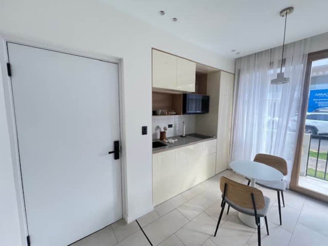 Minimalist bathroom with glass shower, hexagonal floor tile in PH NOOK Bella Vista Panama City