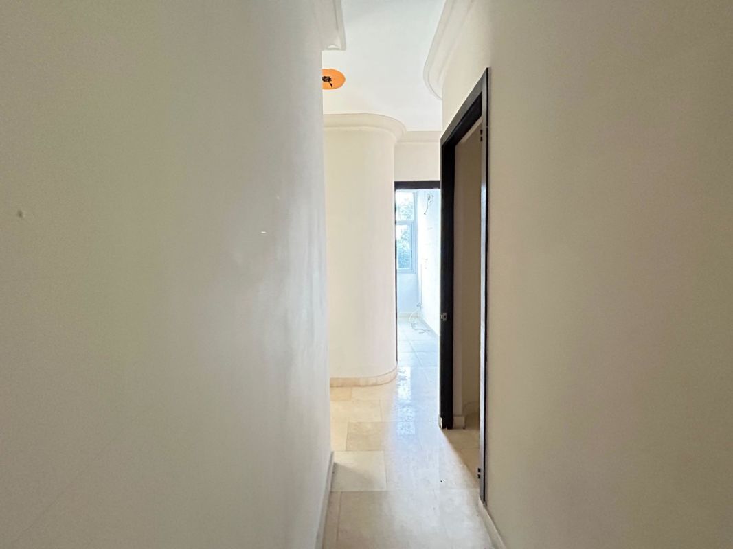 Empty bedroom with tiled floor and wardrobe PH The Bridge Panama.