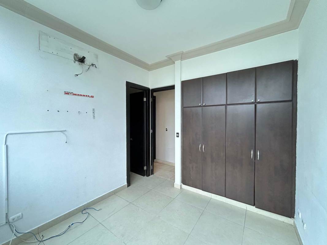 Corner area with floor-to-ceiling glass doors opening to balcony PH The Bridge Amador Panama City.