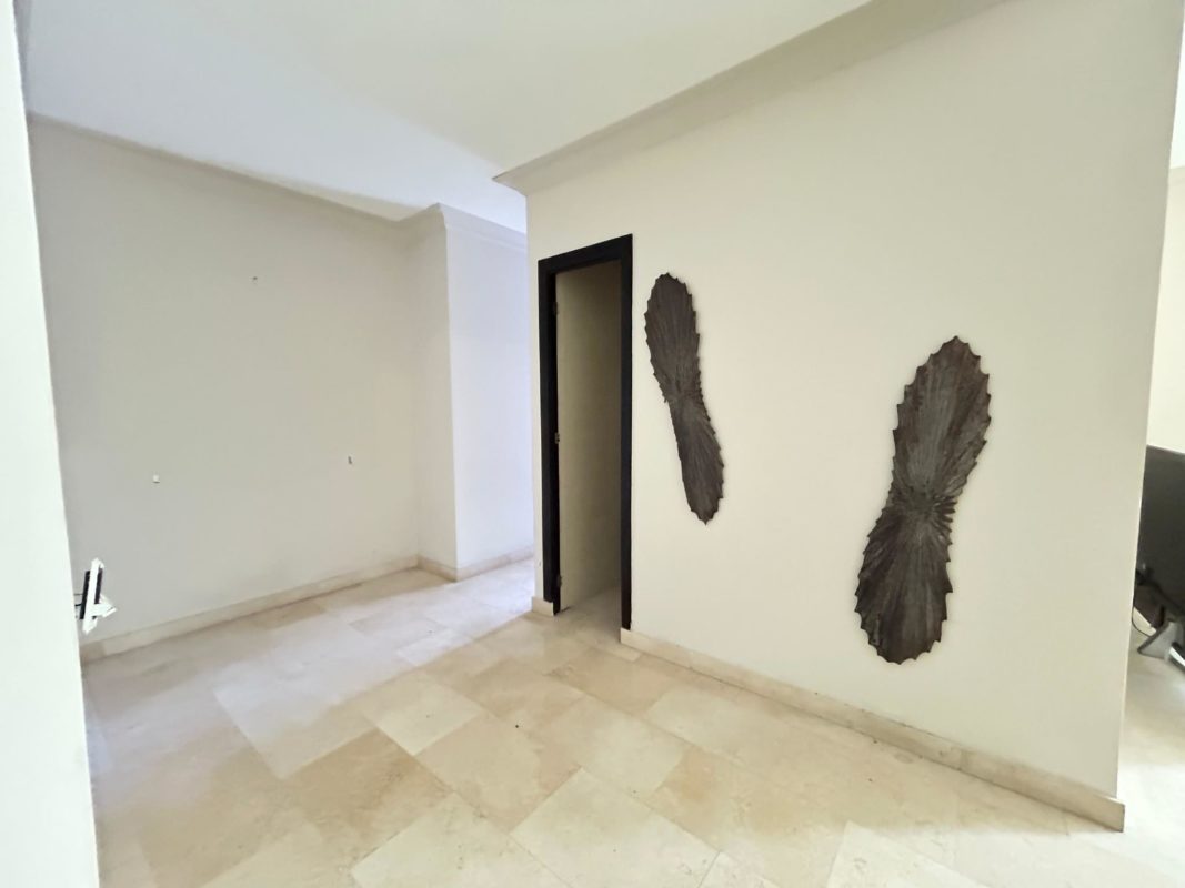 Bathroom with glass-enclosed shower and modern fixtures in The Bridge Amador Panama.
