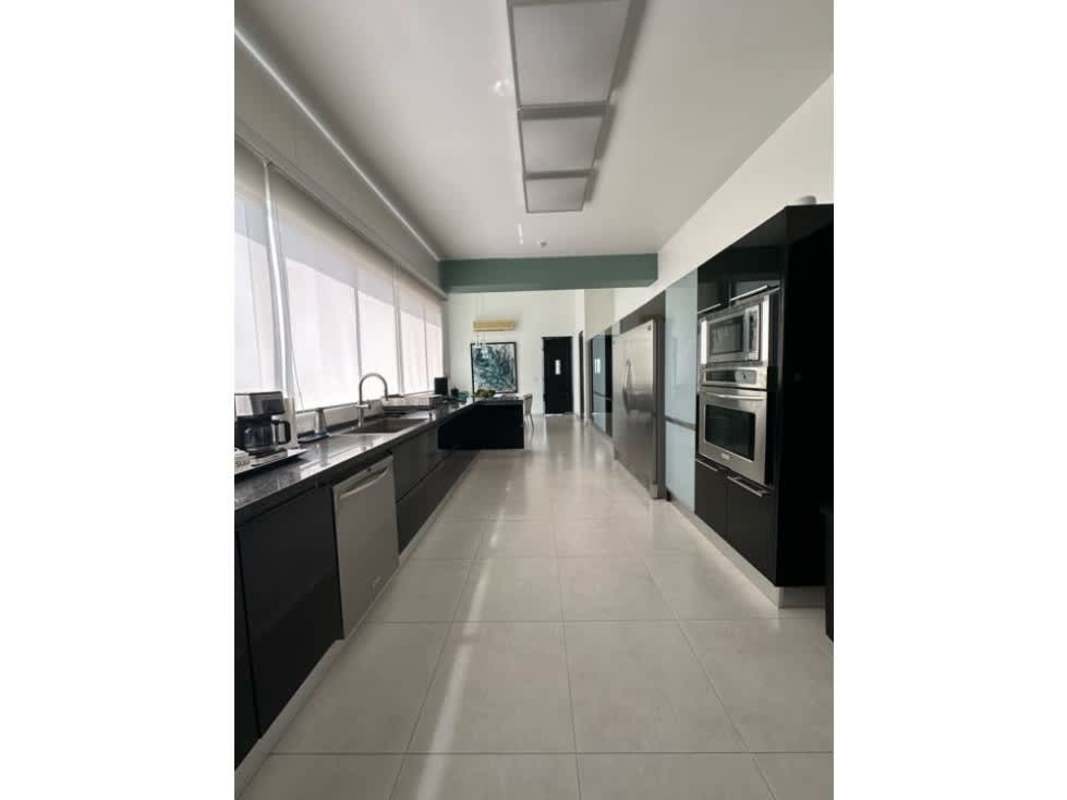 Modern luxury kitchen with island, stone counters, stainless appliances PH Portanova Panama City