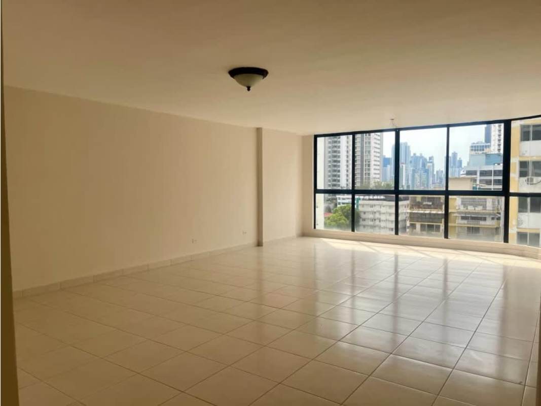 Large living area with floor to ceiling windows, panoramic skyline view, ceramic tiles at PH Terrazas del Cangrejo Panama City