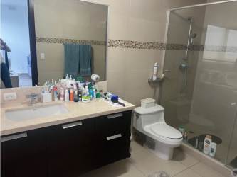 Open kitchen with island, granite counters and stainless appliances in PH Oceanaire