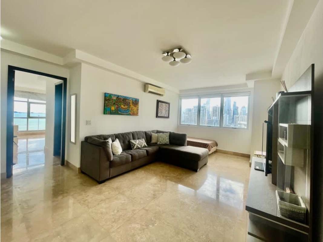 Bright living space with large windows, city skyline visible, PH Q Tower Panama