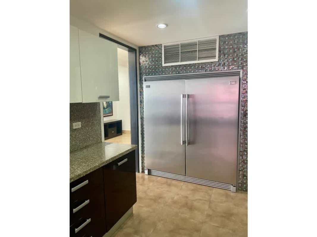 Elegant kitchen with mosaic backsplash, granite counters PH Q Tower Panama