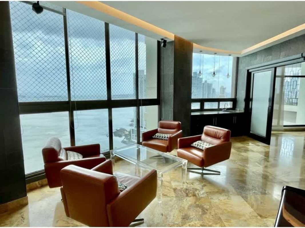 Spacious master bedroom with balcony access, sea views, marble flooring in PH Ocean Park