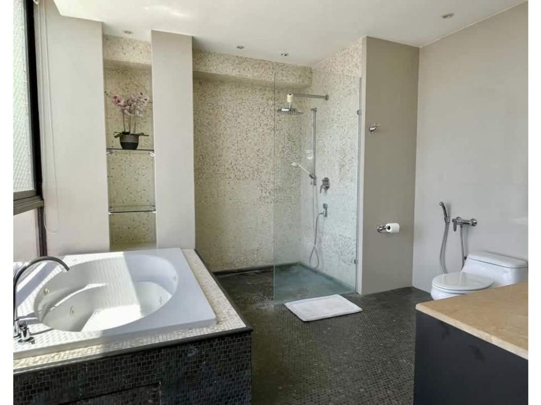 Modern kitchen with granite countertops, appliances, panoramic window at PH Ocean Park