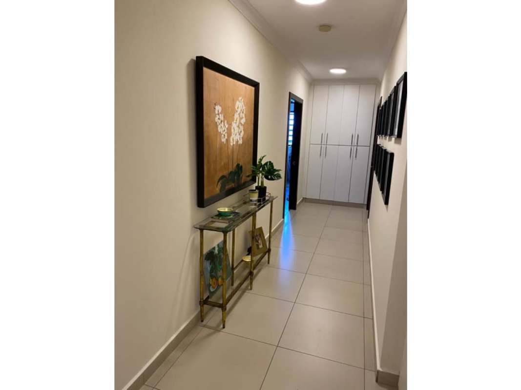 Modern hallway with large art and built-in storage at PH Elite La Cresta Panama City
