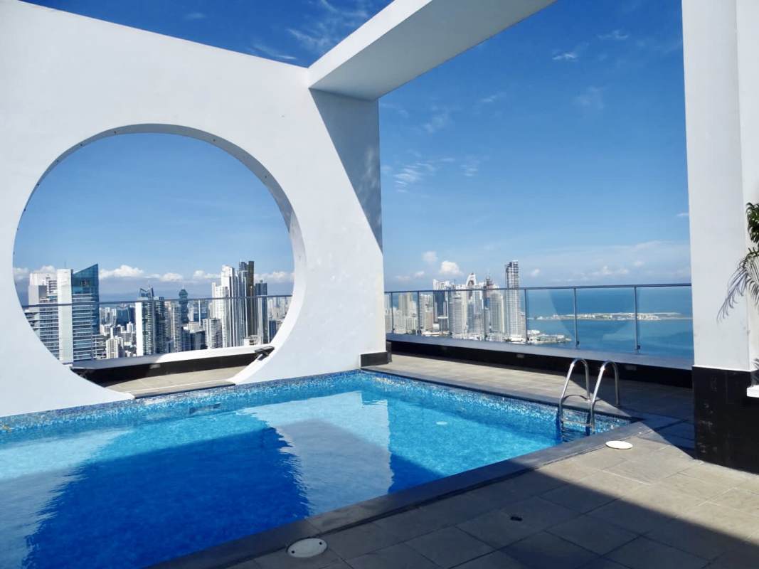 Contemporary kitchen with granite counters, wood cabinets, stainless appliances PH Destiny Panama City