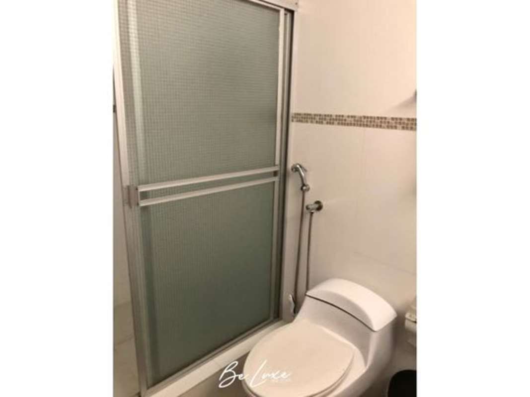 Modern bathroom with glass shower enclosure in PH Sky Level apartment Panama