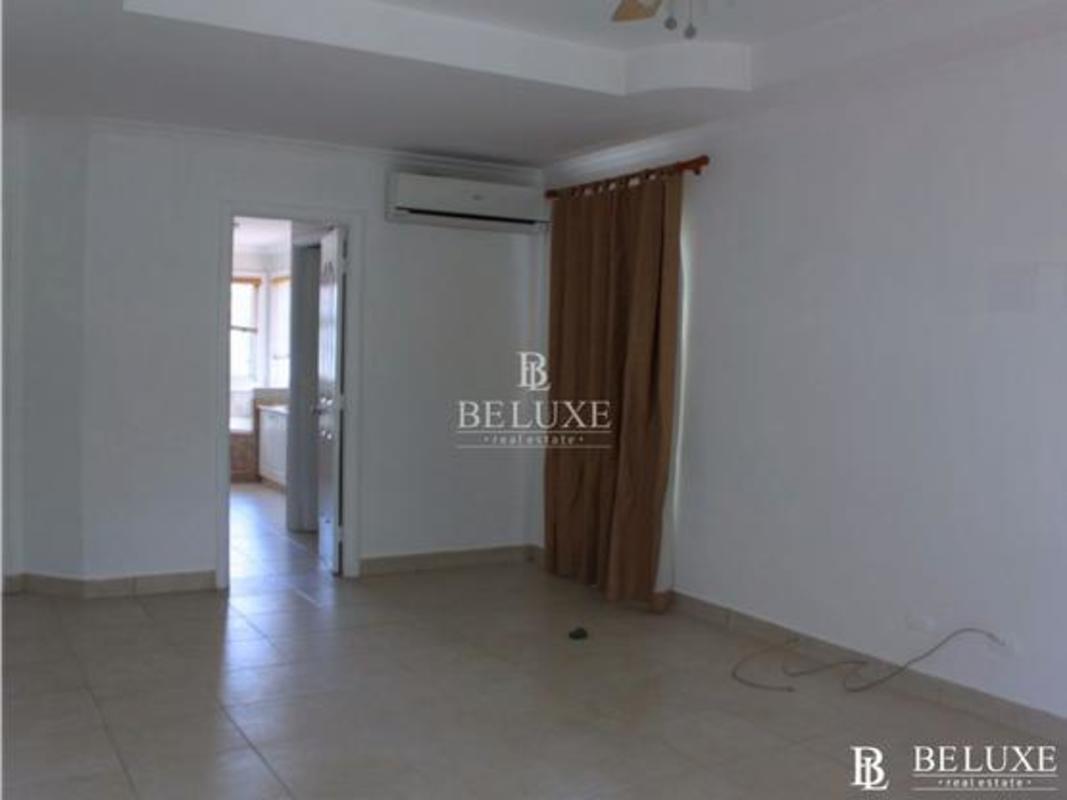 Spacious kitchen with granite counters U-shaped white cabinets Costa Azul Costa del Este Panama