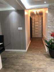 Hallway with recessed lights, wood accents, modern decor in PH Silver City Colón Panama