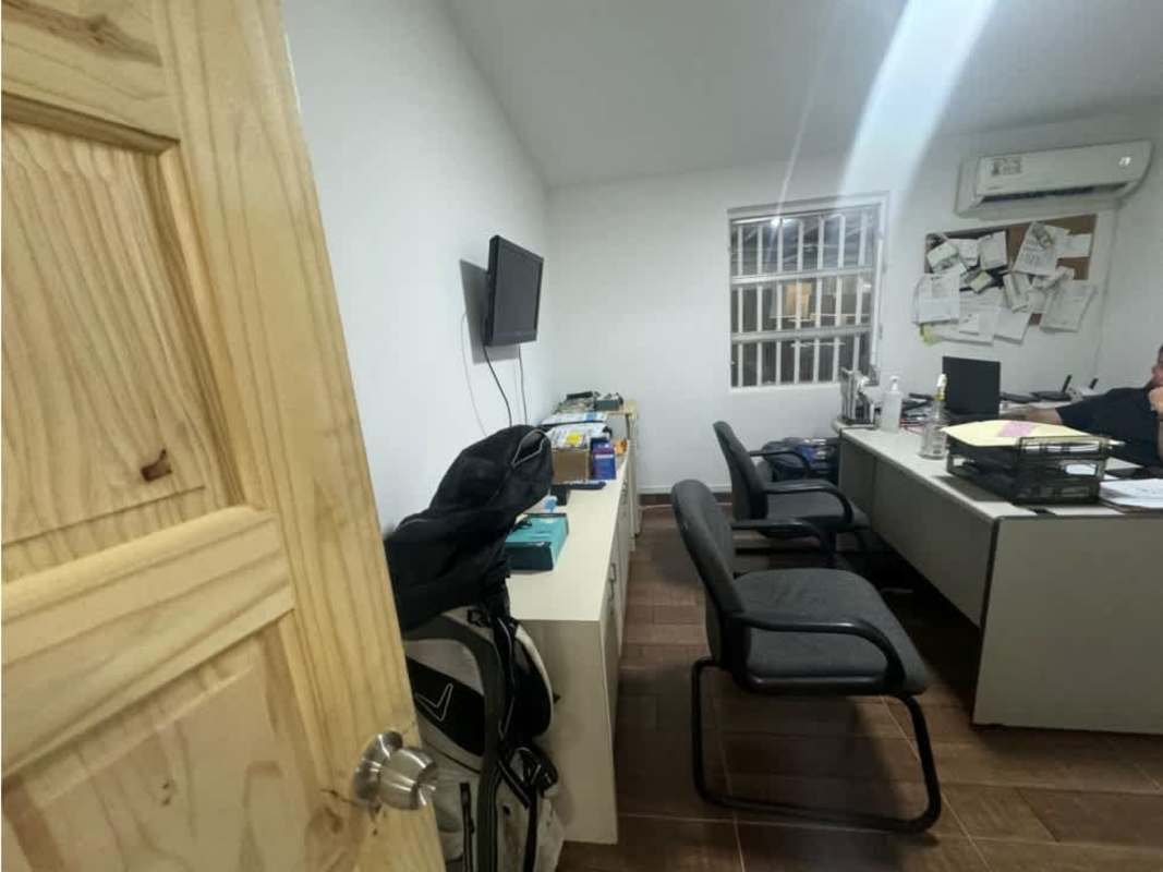 Utility kitchen and rest area inside warehouse with cabinet and table in Llano Bonito Panama