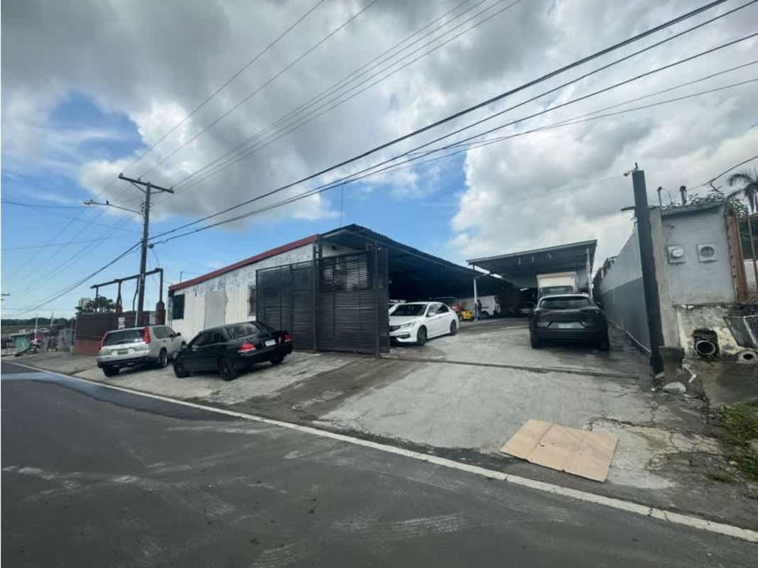 Traditional private commercial office with window, desk, split AC and chairs inside warehouse Panama