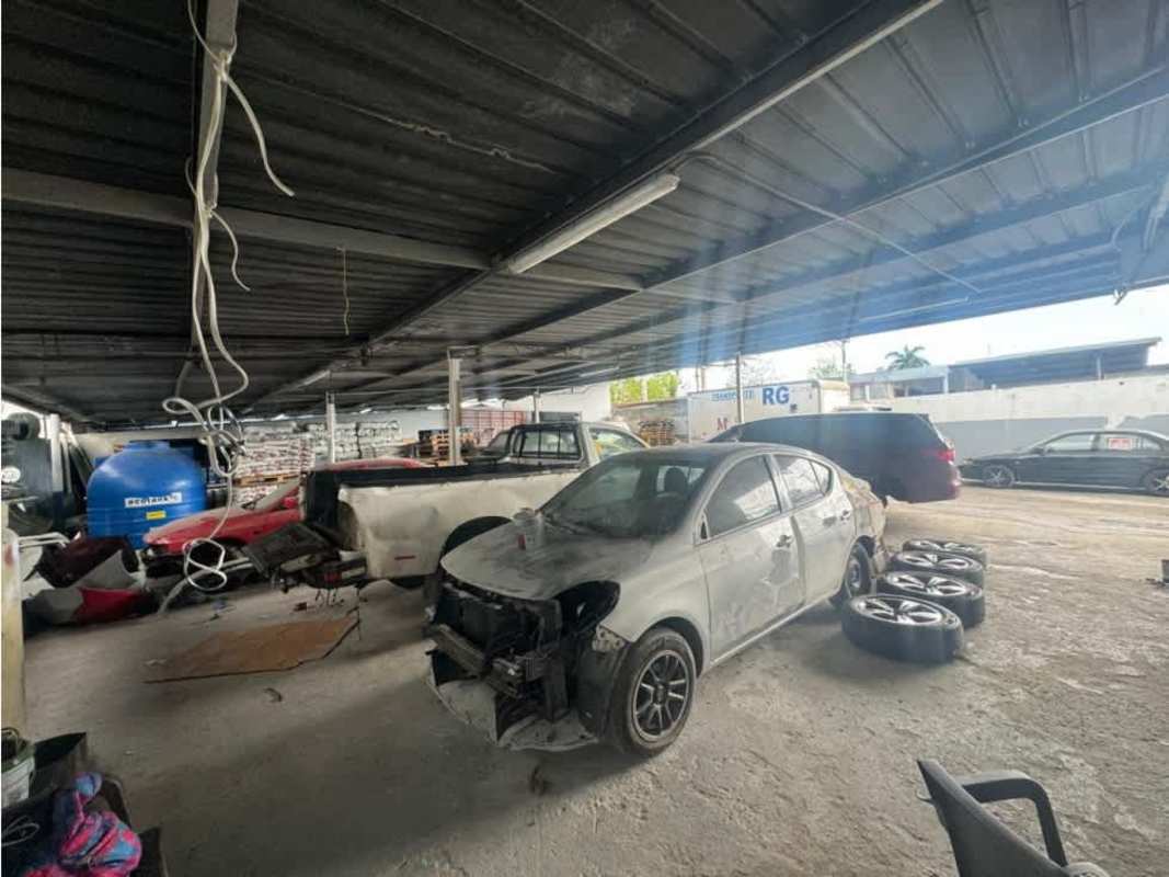 Covered automotive workshop with cars inside industrial warehouse Panama