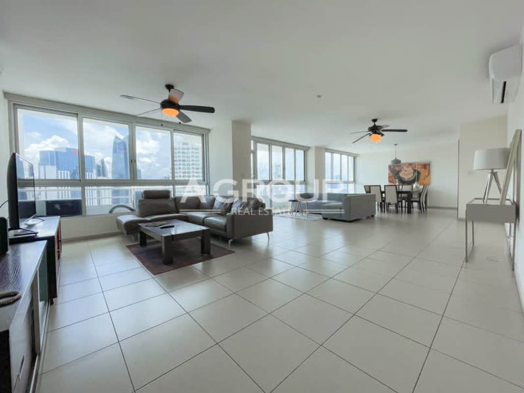 Equipped kitchen with wood cabinets, granite countertops, and appliances at Sol Marina Marbella Panama