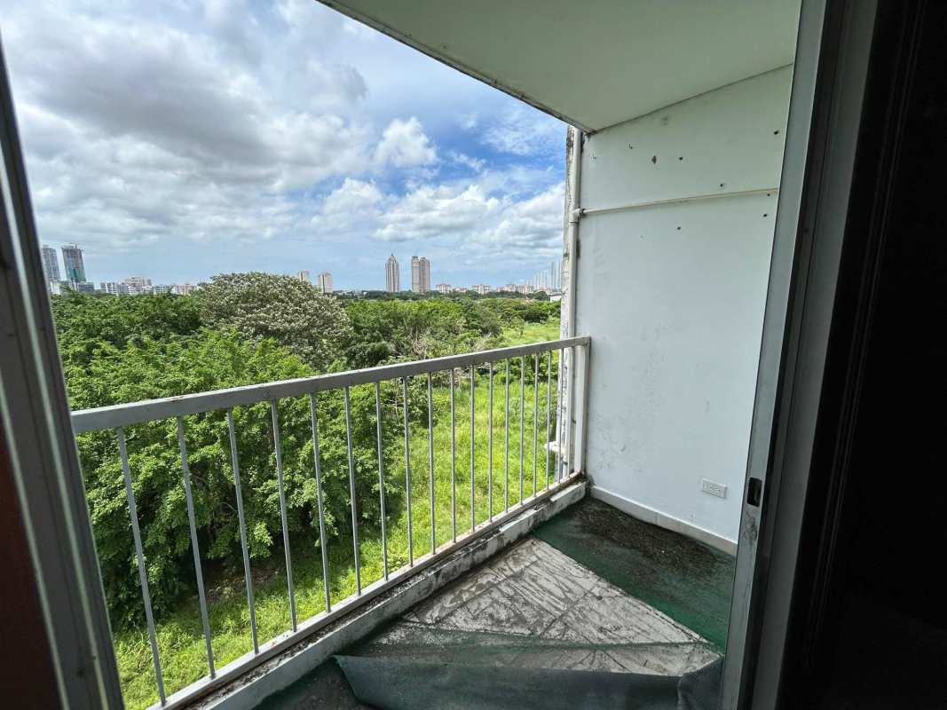 Bathroom with tiled walls shower toilet sink PH Mystic Blue apartment Panama City