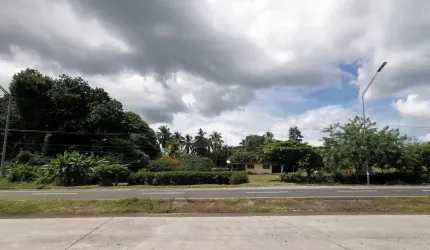 Wide paved highway adjacent to large development land parcel Punta Barco Panama
