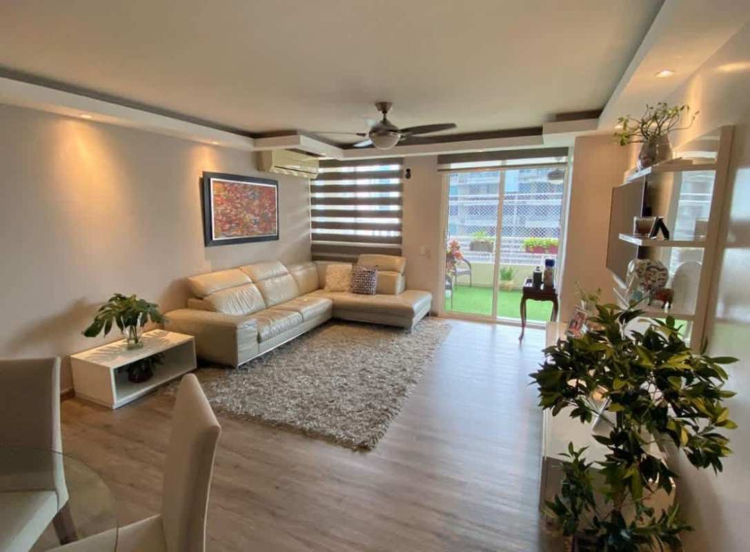 Modern open-plan living room with large windows at PH Obarrio Central Panama